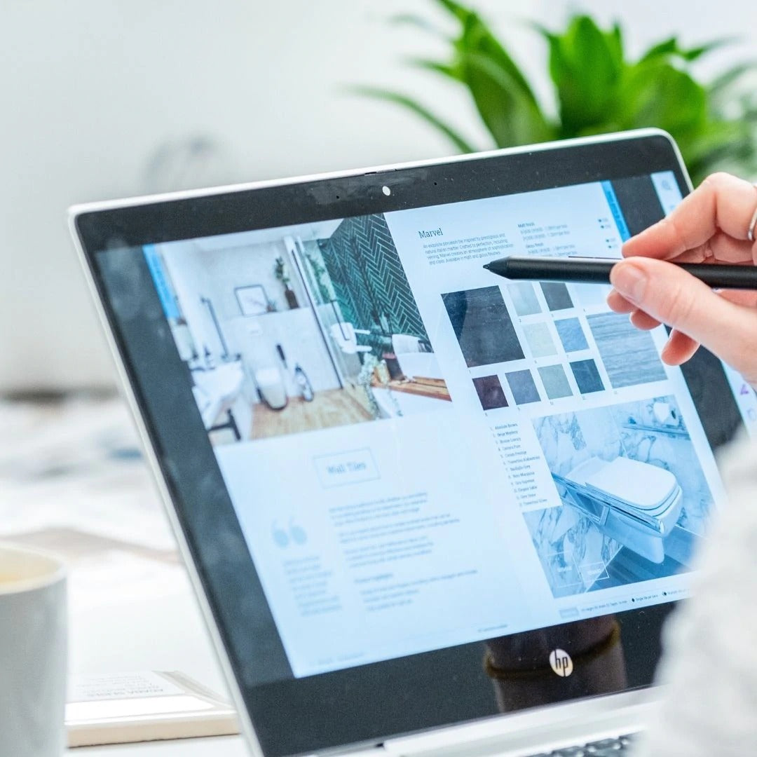 Person viewing a Fine & Able brochure on a tablet