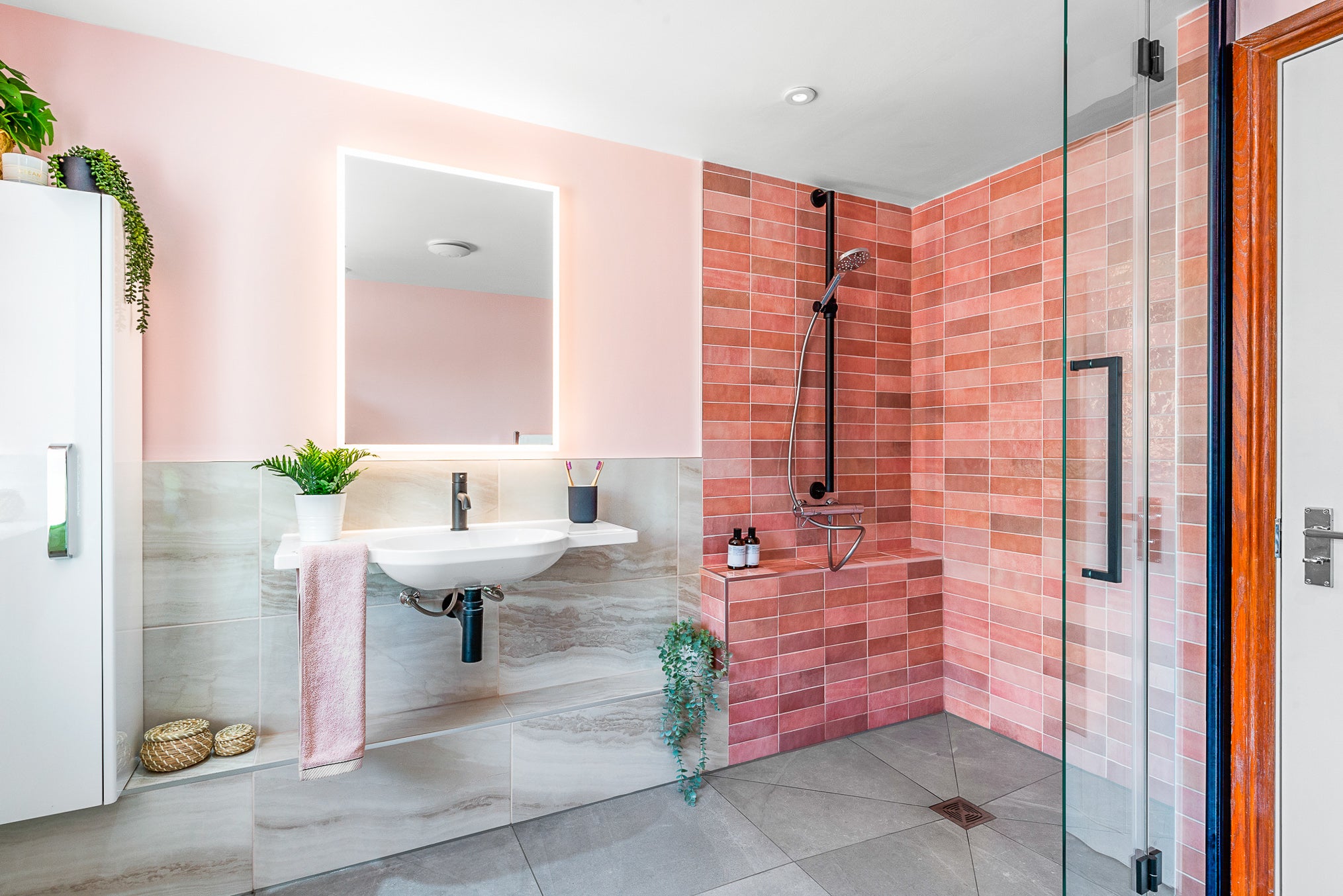 Pink and matt black Fine & Able accessible bathroom