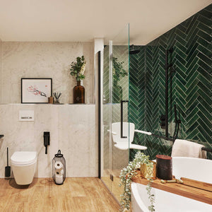 Single Bliss bi-folding shower door with matt black handle in a green tiled bathroom