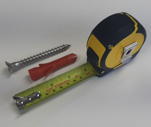 Universal Fixing Kit beside open tape measure to show 10cm length of screw and rawl plug 