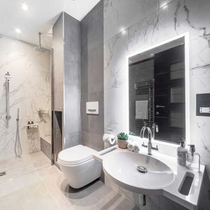 Grey tiled accessible shower room with SurfaceHold basin with plants and soaps on countertop
